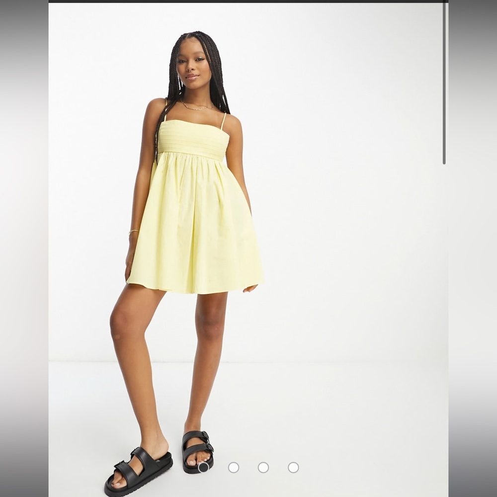 ASOS DESIGN cotton pleat bust babydoll mini sundress in lemon NYT
